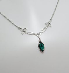 This is a new handmade necklace. It is made with antiqued silver plated Celtic knots, accented with a high quality EMERALD GREEN glass jewel that sparkles like crystal. Decorated portion is 2 1/2" wide and 1 1/4" tall in the center. Necklace is adjustable 15-18" with a lobster clasp and chain extender. If you would like a different length, please send us a message.Matching earrings and headpiece are listed in our store in a variety of stone colors. If you don't see items with a color you want, f Dark Green Emerald Necklace, Emerald Jewelry Silver, Silver And Green Jewelry, Disgust Outfit, Dark Green Jewelry, Silver And Emerald Green, Green Jewelry Necklace, Slytherin Jewelry, Elf Necklace