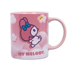 a pink hello kitty coffee mug with the words my melody on it and a cartoon character