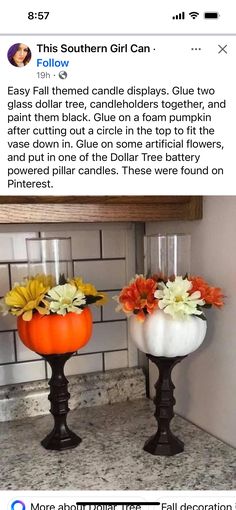 two fake pumpkins with flowers in them sitting on a counter next to each other