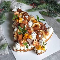 an elaborately decorated christmas cake on a table