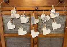 some hearts are hanging on a clothes line