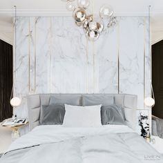 a bedroom with marble walls and white bedding