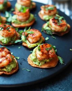 small appetizers with shrimp and guacamole on toasted buns