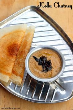 grilled cheese sandwich and dipping sauce on a metal tray