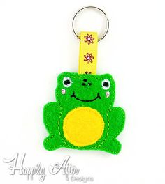 a key chain with a green frog on it