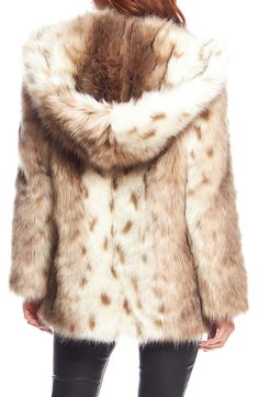 Style a chic outfit with this realistic looking faux fur hooded coat. Attached hood Long sleeves Open front Faux fur construction Lined Faux fur shell: 63% acrylic, 25% modacrylic, 12% polyester/back: 100% polyester/lining: 100% polyester Dry clean Imported Model’s stats for sizing: 5’11” height, 32” bust, 24” waist, 34” hips. Fur Hooded Coat, Gold Fox, Faux Fur Hooded Coat, Fur Hood Coat, Fabulous Furs, Hooded Faux, Fake Fur, Chic Outfit, Autumn Aesthetic