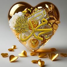 a heart - shaped box filled with gold hearts and arabic writing on the inside, surrounded by scattered golden hearts