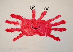 a child's t - shirt with an image of a crab painted on it