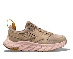 a women's shoe in beige and pink