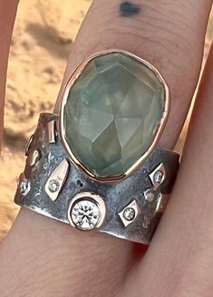 One of a kind Large , beautiful Prehnite ring with lab created diamonds, sterling Silver and 14k solid Gold Ring. Sterling Silver ring with Prehnite set in 14k solid gold bezel and gold elements on the band -oxidized  -Band Width : 12mm -Thickness: 1,5mm  -Lab created diamond 0.14ct  -Lab created diamonds 0.03ct (5pcs) Fits a size 6  This one of a kind statement Ring in Solid 925 Sterling Silver and 14k Gold is absolutely beautiful.  Handcrafted Ring Ring will be packed in a beautiful gift bag and box - ready for giving! PLEASE NOTE-  We offer standard free shipping worldwide (You will receive your order within 7 - 21 business days) And we also offer express shipping with FedEX courier (for additional cost, but You will receive your order within 2 - 5 business days) Please check out my ets Bohemian Rings With Gemstone Accents For Anniversary, Bohemian Anniversary Rings With Gemstone Accents, Unique Anniversary Topaz Ring With Stone Setting, Unique One-of-a-kind Sapphire Ring For Anniversary, Unique Crystal Ring With Gemstone Accents For Anniversary, Unique Gemstone Accented Promise Rings, Unique Opal Ring With Accent Stones, Unique Emerald Ring For Anniversary, Unique Emerald Ring With Stone Setting For Anniversary