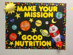 a bulletin board that says make your mission good nutrition with stars and planets on it