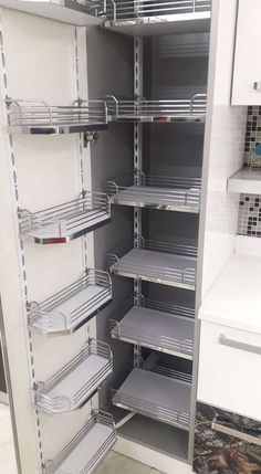 an empty pantry with lots of shelves in it