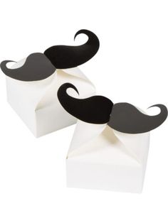 two black and white paper mustaches sitting on top of each other