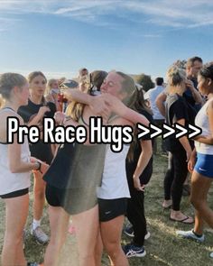 two people hugging each other with the words pre race hugs above them in front of a group of people