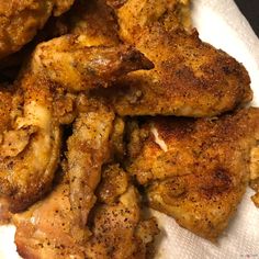 the chicken is cooked and ready to be eaten with seasoning on it's wings