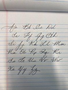 handwriting on lined paper with cursive writing