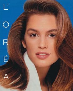 a woman with long brown hair is posing for the cover of an issue of magazine