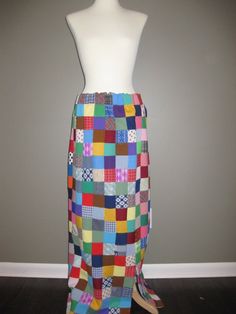 This is a handmade double knit patchwork skirt with a slit up the left leg.  Extremely fun.  Fits size 4-8 current sizing.  There is one tiny spot on the back.  It is virtually unnoticable due to the vibrant and varied colors.  It would be great with a solid turtleneck and boots.  Holiday hostess skirt??? Maxi Rock, Make Do, Patchwork Skirt, Crazy Quilt, Long Maxi Skirts, Double Knit, Crazy Quilts, Double Knitting, Quilt Making