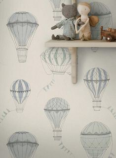 there are many hot air balloons on the shelf