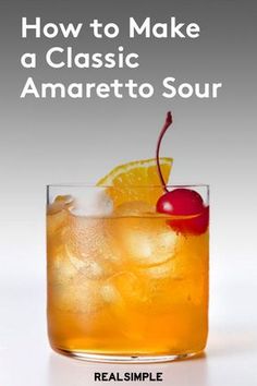 an orange drink in a glass with ice and cherries on the rim text reads how to make a classic anaretto sour real simple