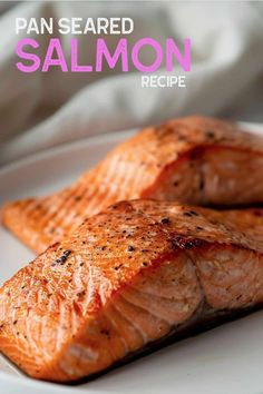 two salmon fillets on a white plate with the title pan seared salmon recipe