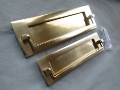 two brass handles on a blue sheet