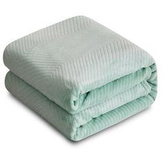 two blankets folded on top of each other, one green and the other light blue