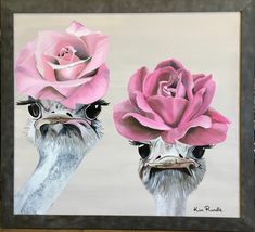 two ostriches with pink roses on their heads