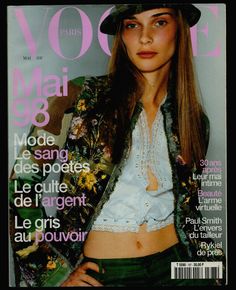 a magazine cover with a young woman wearing a hat and jacket on the front page