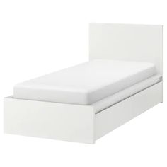 a white bed with two drawers underneath it