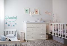 a baby's room with two cribs and a dresser