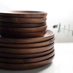 several wooden plates stacked on top of each other