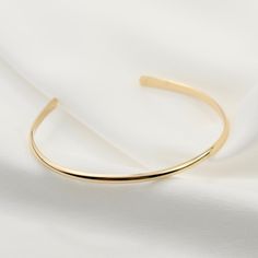 "14K gold cuff bracelet. 14K Gold Minimalist Cuff Bracelet, Delicate cuff bracelet. The bracelet will be shipped in a gift box * 14K solid gold. It is about 2.5mm width. Please select the size of your wrist. If your wrist is 6\", please purchase a 6\" bracelet. (If you order a 6\" bracelet, actual cuff length will be 5\" plus 1 inch opening.) Please read our policies before you place your order. https://www.etsy.com/shop/SashJewelry/policy?ref=shopinfo_policies_leftnav To see other Mother daught Elegant Open Band Bangle Gift, Gold Open Cuff Elegant Jewelry, Timeless Gold Open Cuff Bracelet, Elegant Gold Open Cuff Jewelry, Elegant Cuff Bangle As A Gift, Classic Gold Open Cuff Bracelet, Elegant Gold Open Band Bangle, Gold Minimalist Bangle For Formal Occasions, Gold Minimalist Bracelet For Formal Occasions