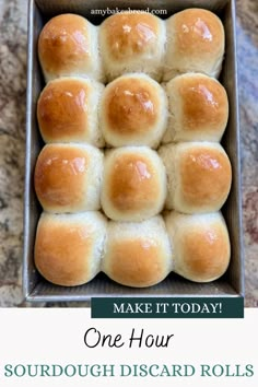 a box filled with bread rolls sitting on top of a counter next to the words make it today one hour sourdough discard rolls