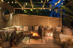 a fire pit sitting on top of a wooden deck