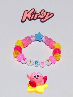 two bracelets that say hello kitty and one with a star on it