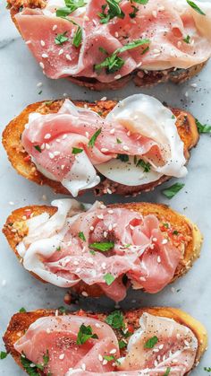 three pieces of bread topped with meat and cheese