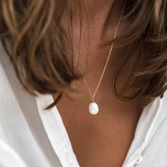 Featuring a baroque pearl on a silver chain, this necklace will glow against your skin like a drop of moonlight. The pearl measures 12-13mm and the adjustable chain can be worn at 17", 19" or 21".


Baroque pearls are irregular in shape, meaning your pearl will have its own unique shape! Silver Pearl Necklace, Chic Necklace, Baroque Pearl Necklace, Sustainable Jewelry, Freshwater Cultured Pearls, Traditional Jewelry, Freshwater Pearl Necklaces, Simple Necklace, Stainless Steel Necklace