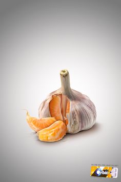 an onion and peeled oranges on a gray background