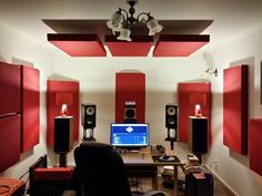 a room filled with speakers and a computer