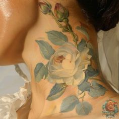 a woman with a flower tattoo on her back