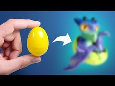 a hand holding an egg in front of a small toy pokemon figurine on a blue background