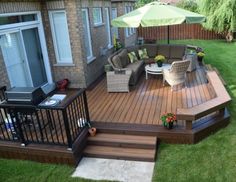 a deck with chairs and an umbrella over it