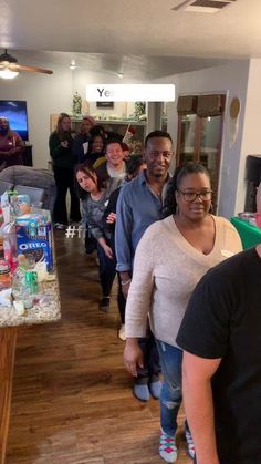 a group of people standing in a room