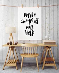 a poster with the words maybe singing will help on it next to two wooden chairs