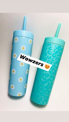 two blue tumblers sitting next to each other