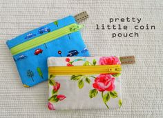 two small zippered pouches with flowers on them