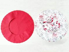 two red and white plates sitting next to each other