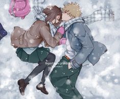 two people are kissing in the snow