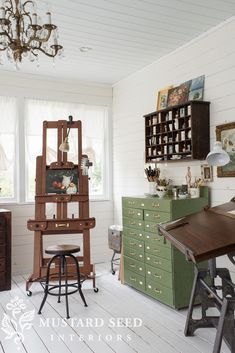 a room with lots of furniture in it and a chandelier hanging from the ceiling